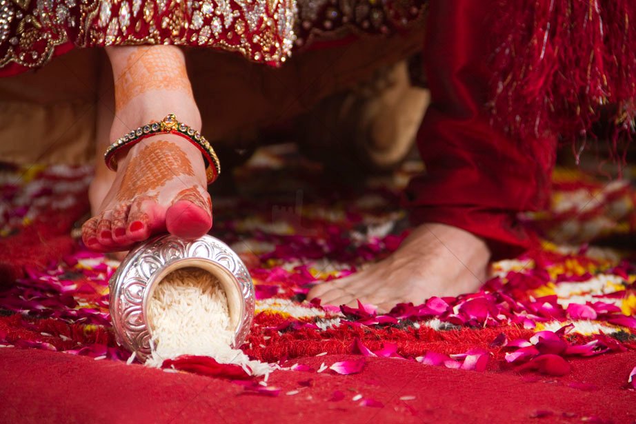 Why Do Newly Wed Brides Kick A Pot Of Rice With Their Feet During Grihapravesh
